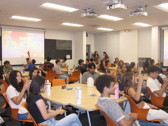 Latine Student Association a group of students sitting down in a classroom