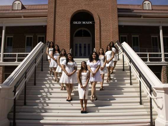 members of Sigma Lambda Gamma standing in front of Old Main