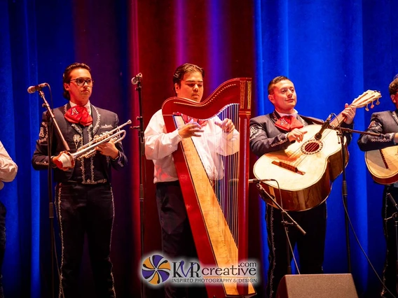 5 members of Mariachi Arizona playing instruments
