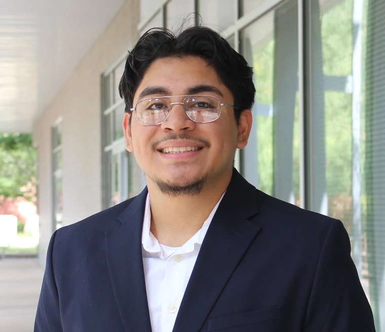 Person wearing glasses smiling