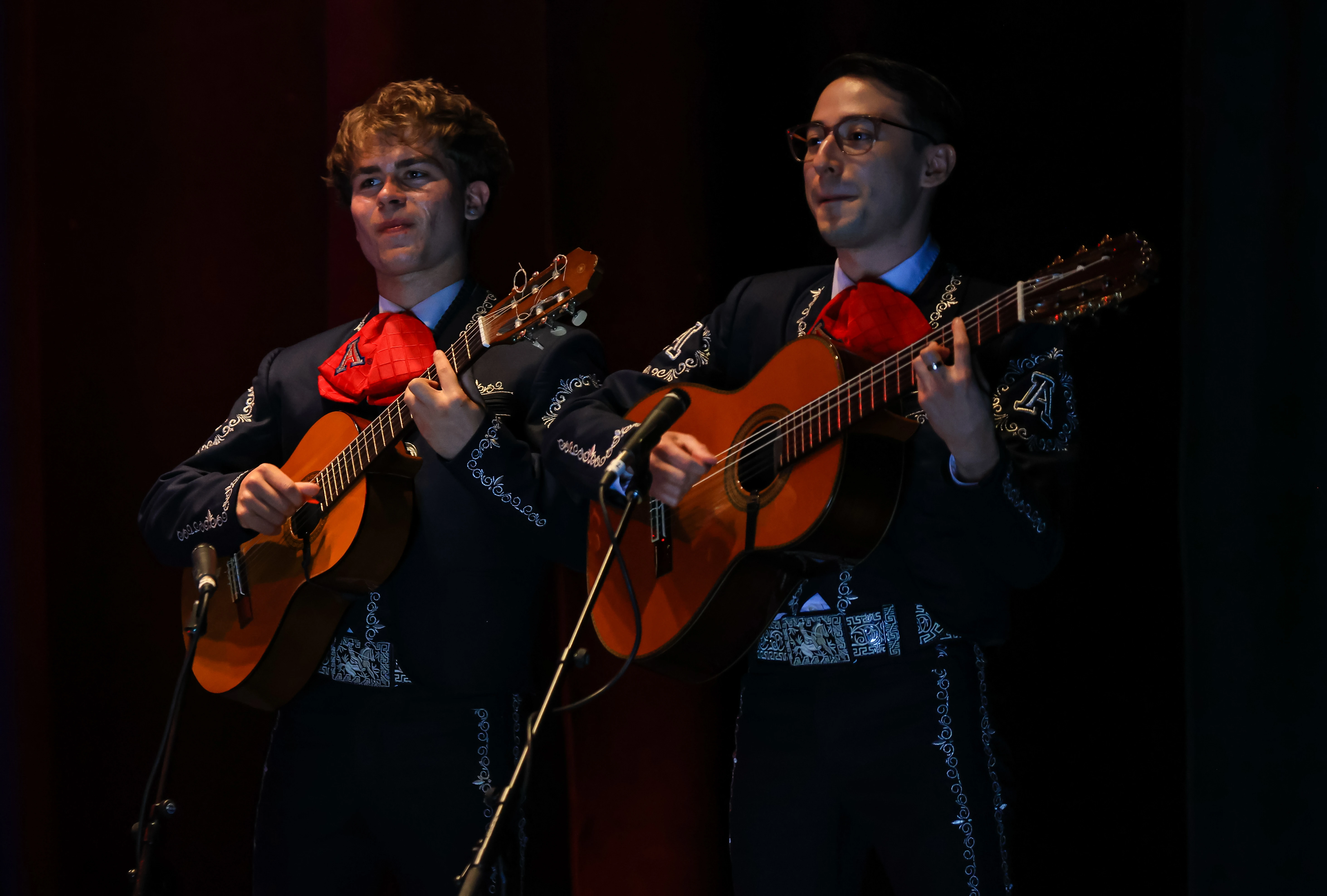 2 members of Mariachi Arizona playing instruments