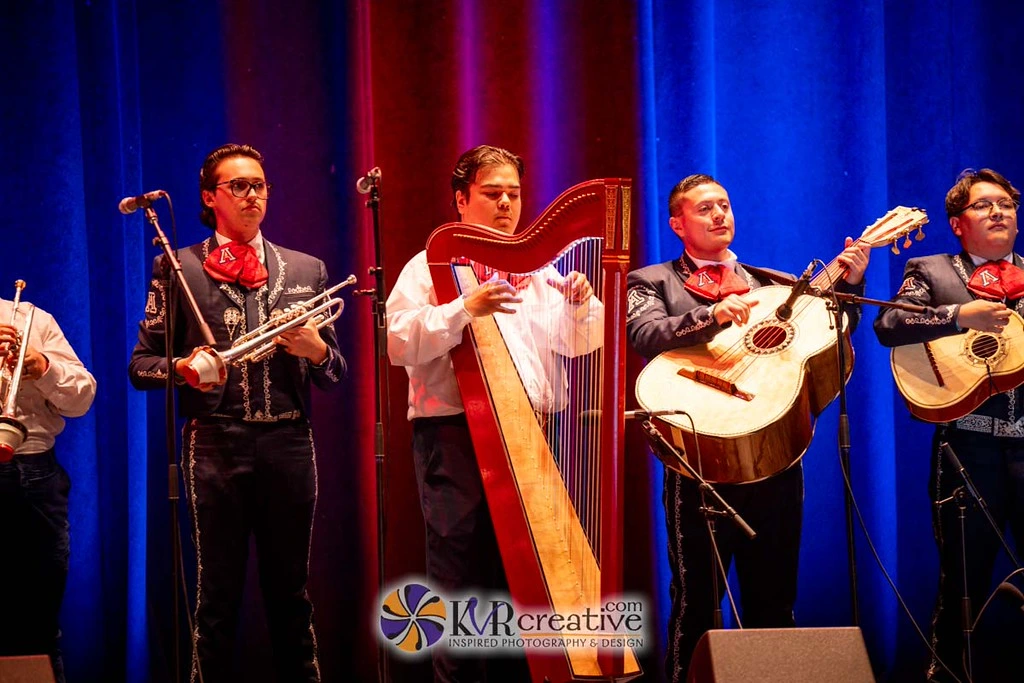 5 members of Mariachi Arizona playing instruments