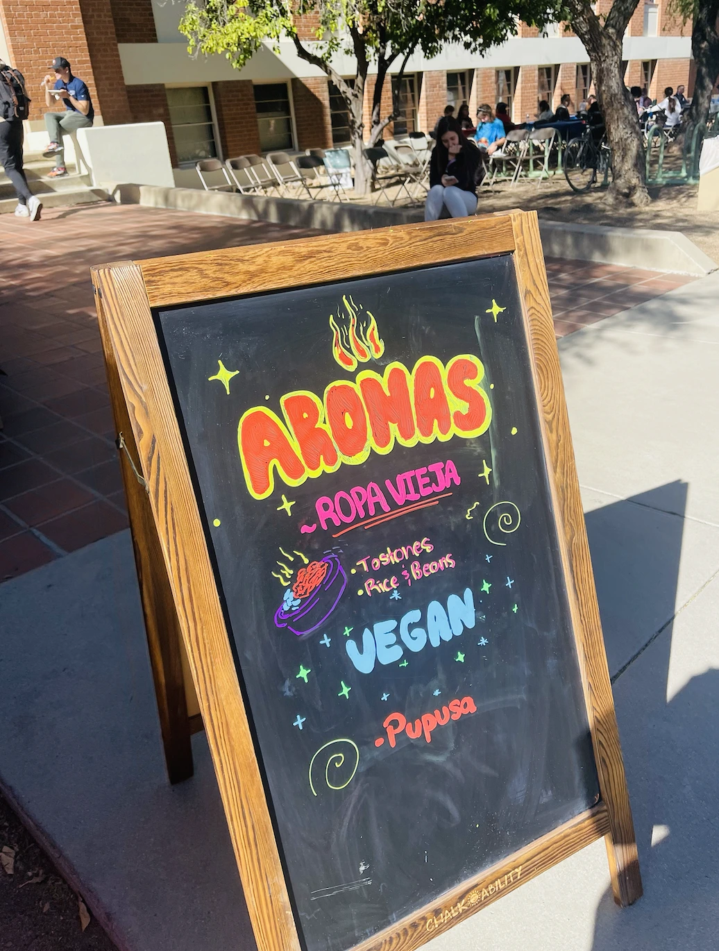 Sign with the words "AROMAS" on display